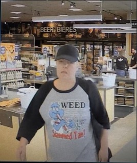 Person wearing a baseball cap and t-shirt with a cartoon image and the words &quot;WEED Slammed I am!&quot;