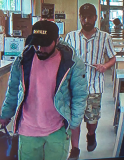 Two men in a store.