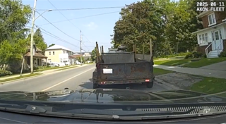 Trailer loaded with lumber.