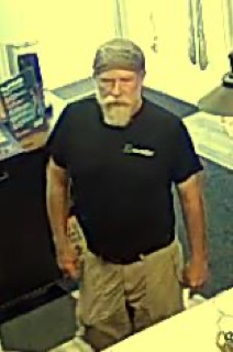 Man with graying beard and cap