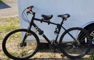 Black mountain bike with a water bottle cage