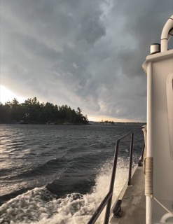 Choppy water and dark clouds.