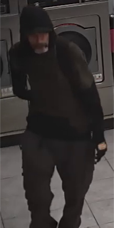 Person wearing a black hoodie and pants