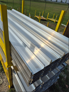 Stacked corrugated metal sheets