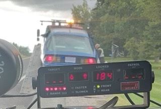 Police car with visible dashboard display showing &quot;184&quot;