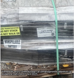 Battery labeled &quot;Nonspillable&quot; secured with green tape