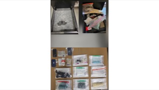 Small bags of various items on a cardboard surface.