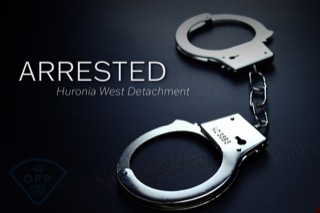 Handcuffs on a black surface.