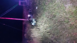 Vehicle on grass, dark background