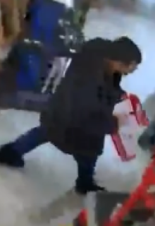 Person carrying red packages