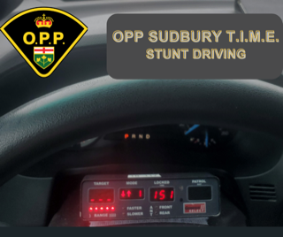 OPP crest, black dashboard, digital display, text: OPP SUDBURY T.I.M.E. STUNT DRIVING