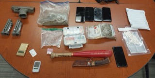 Firearm, scales, baggies, cell phones, pills, baseball bat, knife