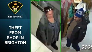 Two people wearing winter clothing and masks walking in snow. Theft from shop in Brighton. E251667523