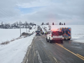 Ambulance and SUV on a snow-covered road