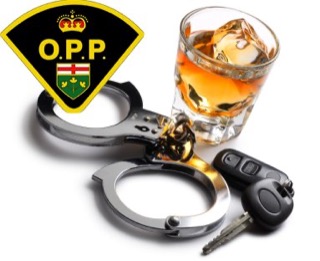Handcuffs, car key, glass of whiskey