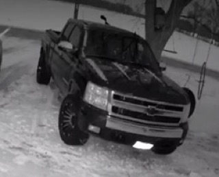 Black pickup truck in snow