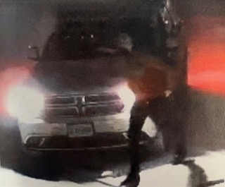 Car with a person standing nearby