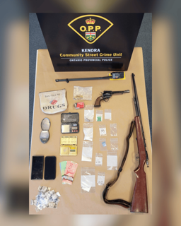 Kenora Community Street Crime Unit, Ontario Provincial Police. Bag full of drugs. Cash, pills, and a revolver on a table.