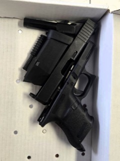 Black handgun and magazine