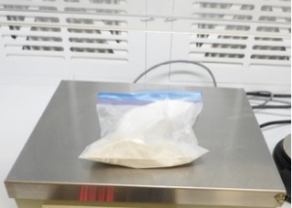 White powder in a plastic bag on a scale