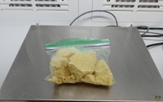 White powder in a plastic bag on a scale