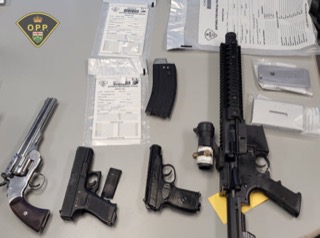 Firearms and documents on a table