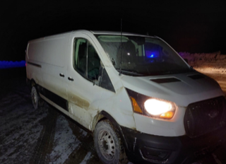 White van with blue emergency lights.