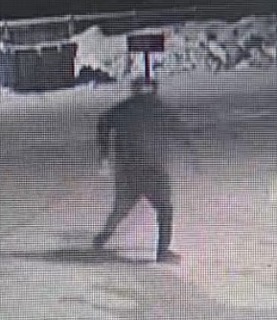 Person standing in darkness