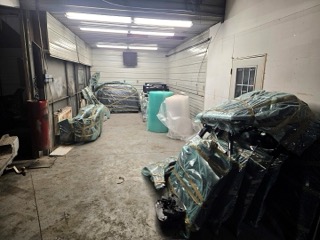 Wrapped furniture in a warehouse.