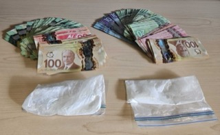 Canadian banknotes, mostly 100s, in clear plastic bags