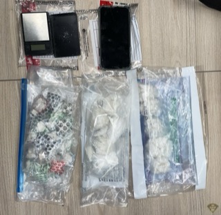 Small baggies and a digital scale on a countertop.