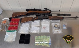 Rifle with scope, ammunition, documents, cash, and cell phones