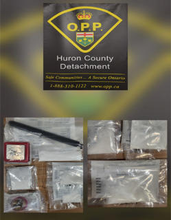 OPP logo and Huron County Detachment text. 1-888-310-1122 www.opp.ca. Various drug packages on a wooden surface.
