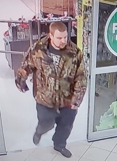 Man wearing a camouflage jacket and dark pants
