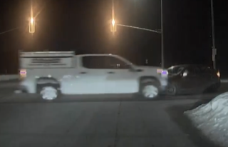 Two vehicles involved in a collision, dark and snowy conditions