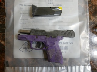 Purple pistol in a plastic bag