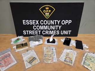 Essex County OPP Community Street Crimes Unit. Canadian and US currency in small plastic baggies.