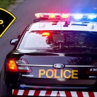 Police cruiser, black, with flashing lights