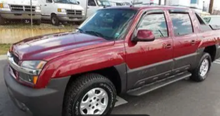 Red Chevrolet Tahoe SUV