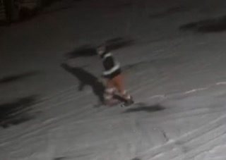 Person skateboarding at night