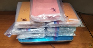 Stack of clear plastic bags with colorful fabric samples