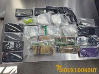 Several smartphones and bundles of cash.
