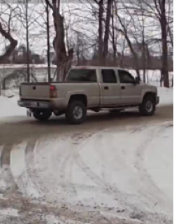 Gray pickup truck on a snowy road