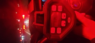 Close-up of a red car's infotainment screen and dashboard.