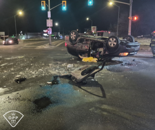 SUV on its roof in intersection