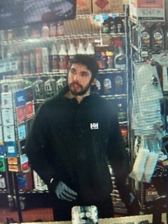 Man with beard wearing a black hoodie