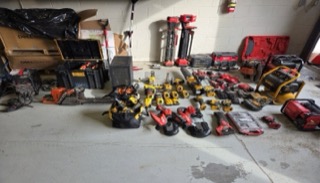 Pile of power tools and equipment.