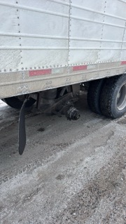 Trailer with black mud flap and tire