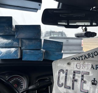 Stacked blue bricks, Ontario license plate, dashboard