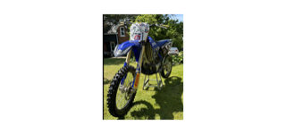 Blue and yellow dirt bike